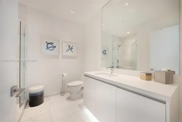 a room with a chair and a chandelier