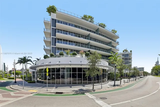 a view of a bedroom with furniture and natural light