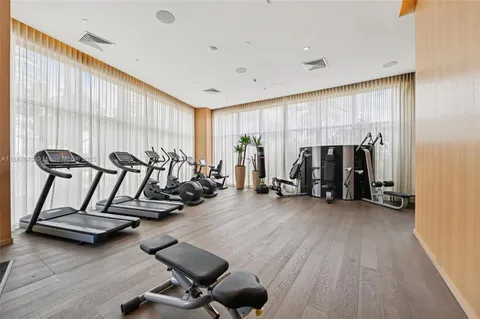 a balcony with furniture and wooden floor