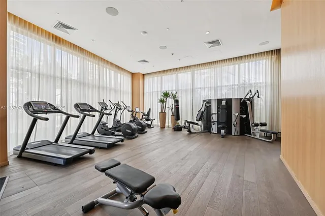a balcony with furniture and wooden floor