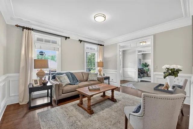 a kitchen with kitchen island granite countertop a sink a counter top space and stainless steel appliances