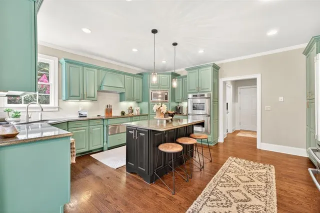a bathroom with a toilet a sink and a window