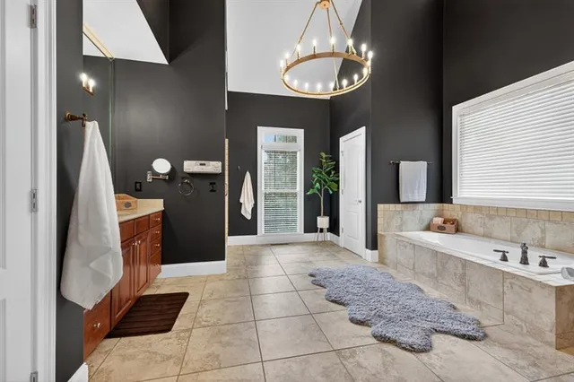 a front view of a house with a yard and a garden