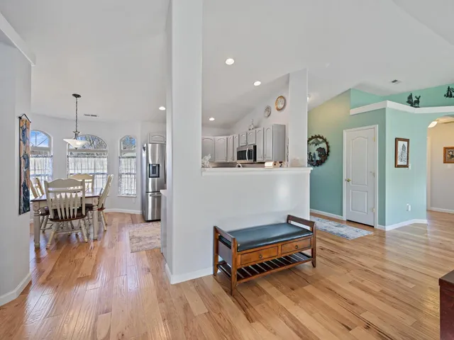 a room with furniture and wooden floors