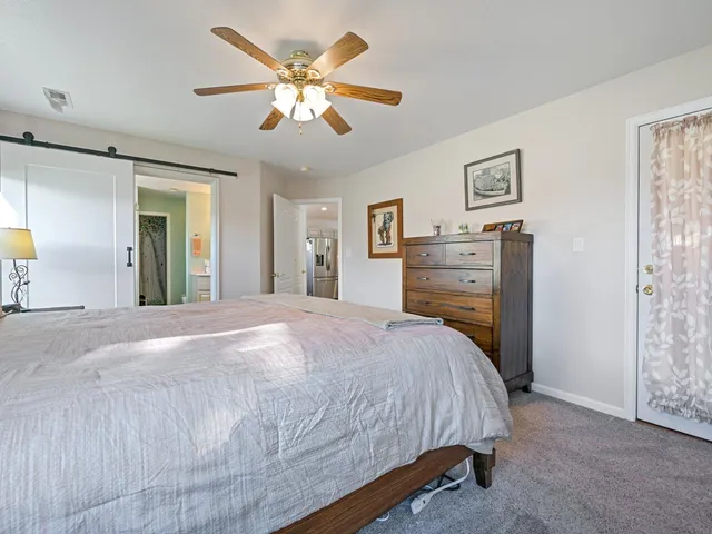 a bed room with a bed and a chandelier