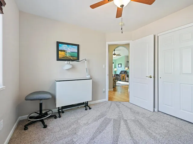 a bathroom with a sink toilet and a mirror
