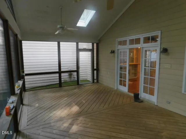 a view of a livingroom with wooden floor and a window