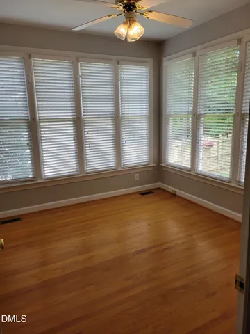 a view of an empty room with a window