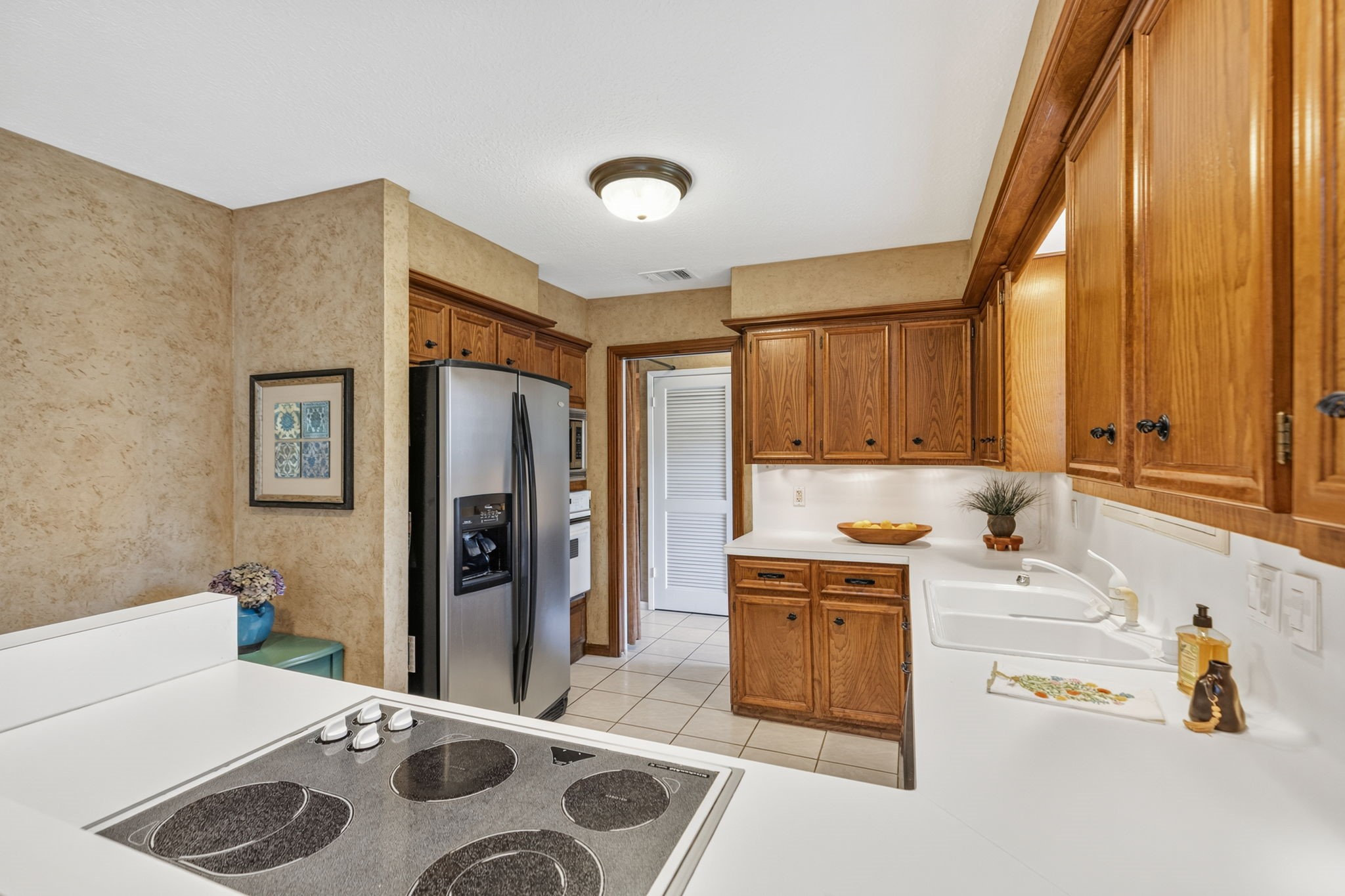 3414 Flaming Candle Drive Spring, TX 77388 - Photo 18 of 50 KITCHEN - Behind the kitchen door is the utility room & mud room.