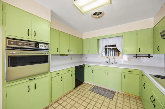 a kitchen with a sink and cabinets
