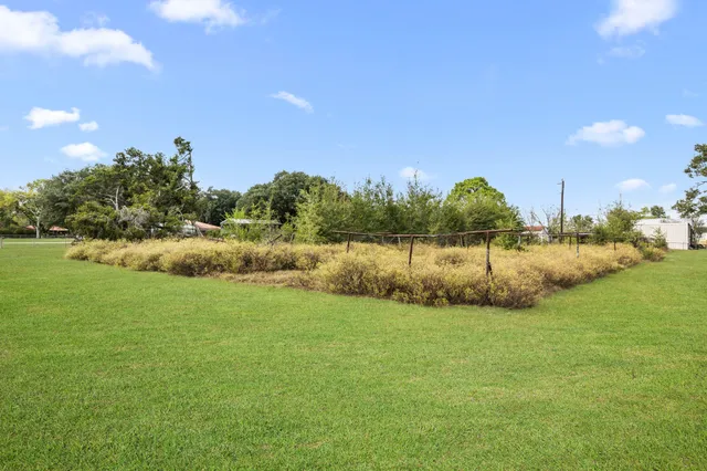 a view of a lake with houses in the background