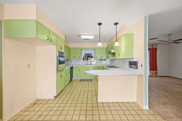 a kitchen with a refrigerator a sink and dishwasher