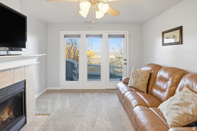 14820 175 East Draper, UT 84020 - Photo 17 of 39 Living room with a fireplace, light carpet, and a ceiling fan