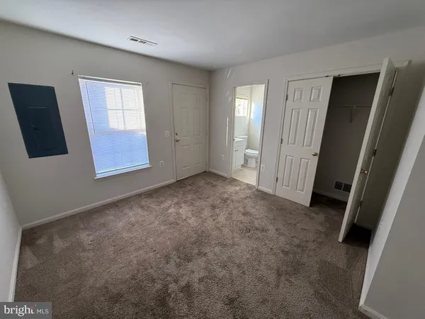 a bathroom with a sink a mirror and a toilet