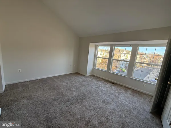 a view of a big room with closet and wooden floor