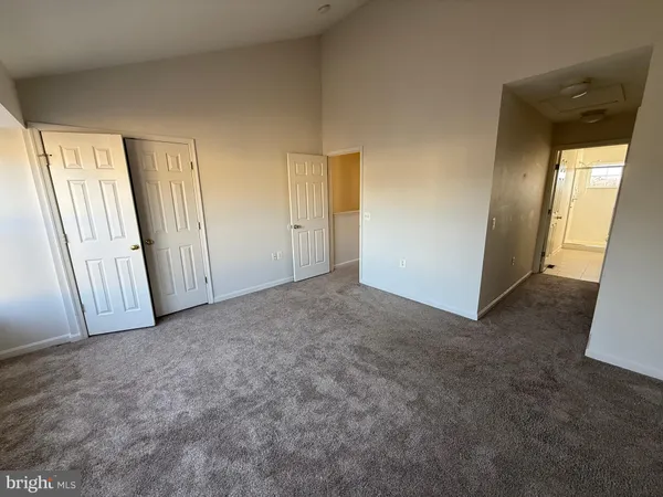 a bathroom with a double vanity sink mirror and toilet
