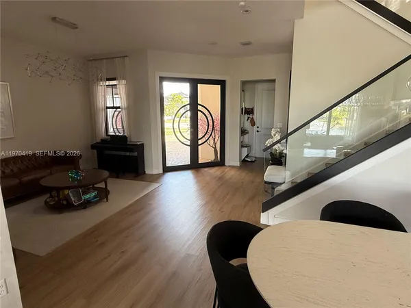 a living room with furniture and a large window