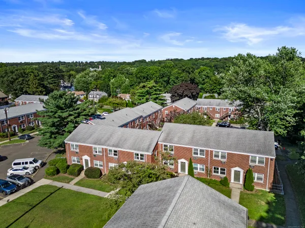 an aerial view of house with a garden