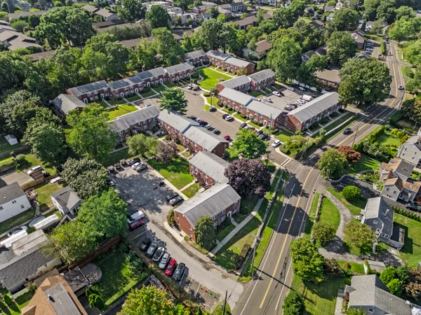 an aerial view of a house with a yard