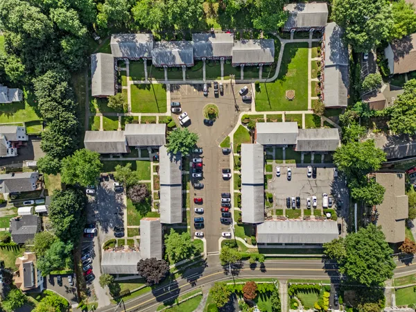 an aerial view of houses with swimming pool and outdoor space