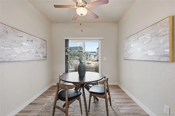 a view of a dining room with furniture and wooden floor