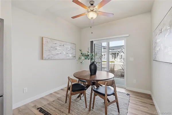 a dining room with furniture and window