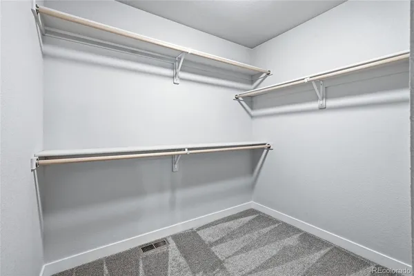 a view of an empty walk in closet