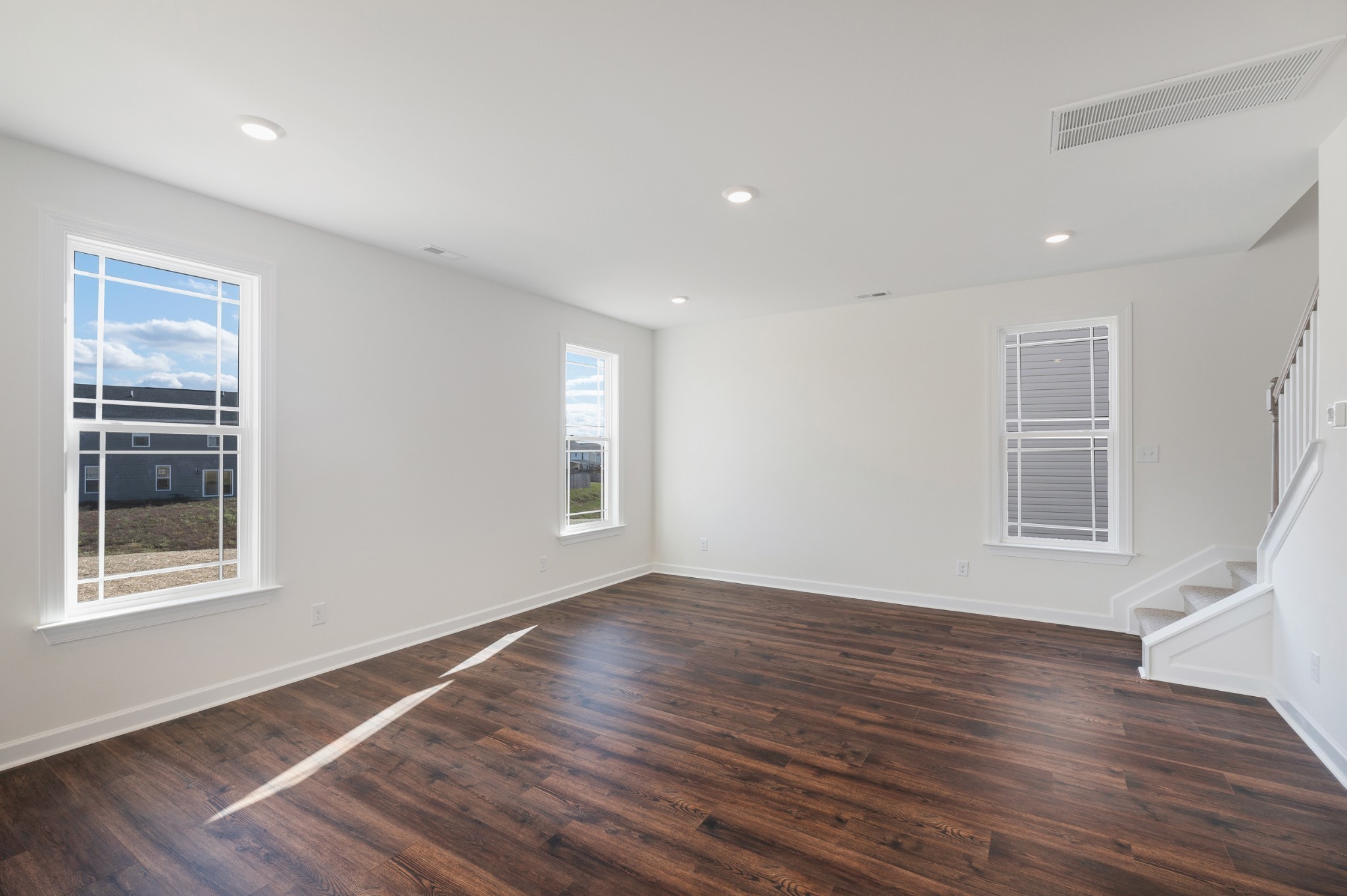 4010 Rampart Way Spring Hill Spring Hill, TN 37174 - Photo 16 of 34 a view of an empty room with wooden floor and a window