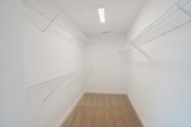 a view of a room with white walls