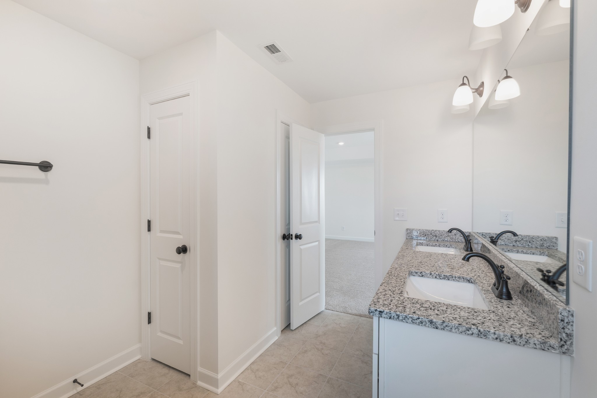 4010 Rampart Way Spring Hill Spring Hill, TN 37174 - Photo 31 of 34 a bathroom with a granite countertop sink and a mirror