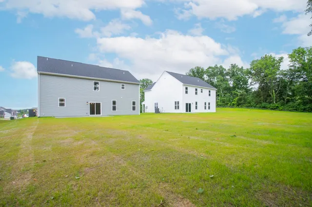 a house view with swimming pool in front of it