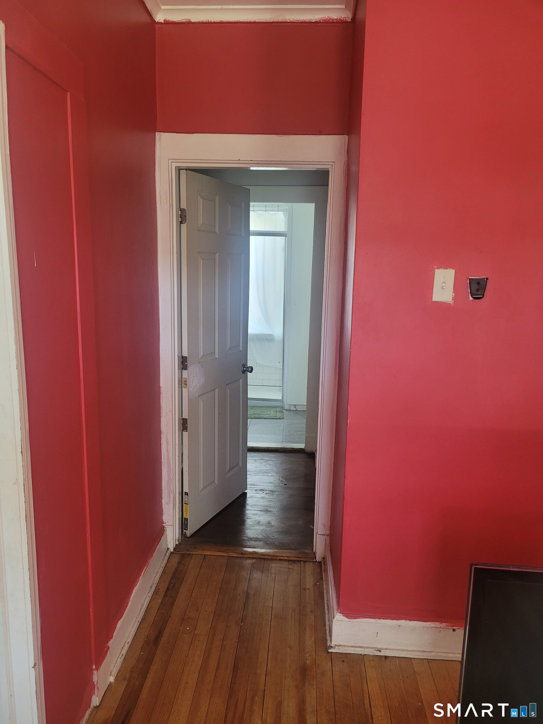 606 Wilmot Avenue, Unit 4 Bridgeport, CT 06607 - Photo 7 of 16 a view of a hallway with wooden floor