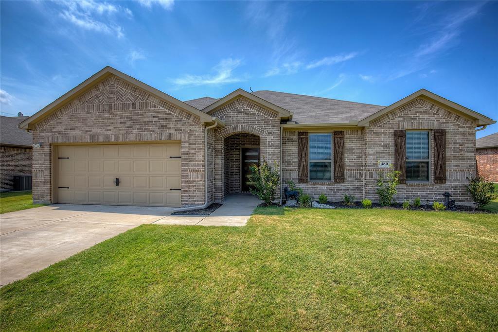 480 Collin Street Nevada, TX 75173 - Photo 1 of 1 a front view of a house with a yard and garage