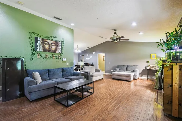 a kitchen with stainless steel appliances a stove a microwave and a refrigerator