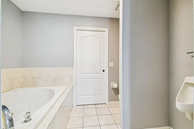 a view of a city with lush green forest