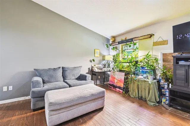 a view of a house with garden and sitting area