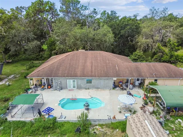 an aerial view of residential house with outdoor space