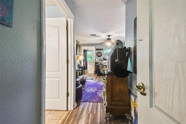 a view of a city with lush green forest