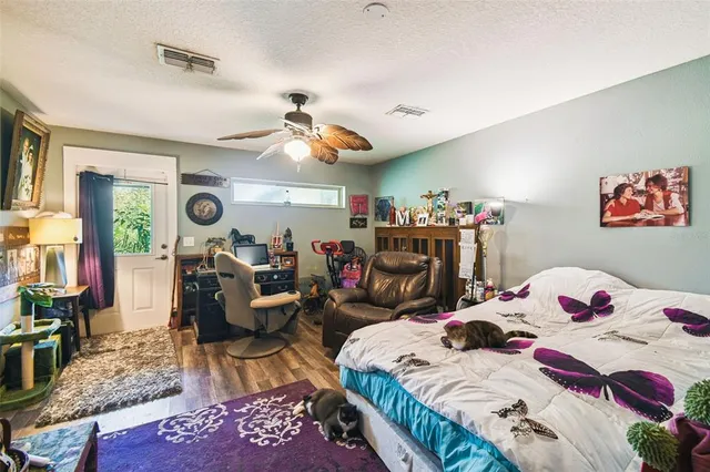 a aerial view of a house with a yard basket ball court and outdoor seating