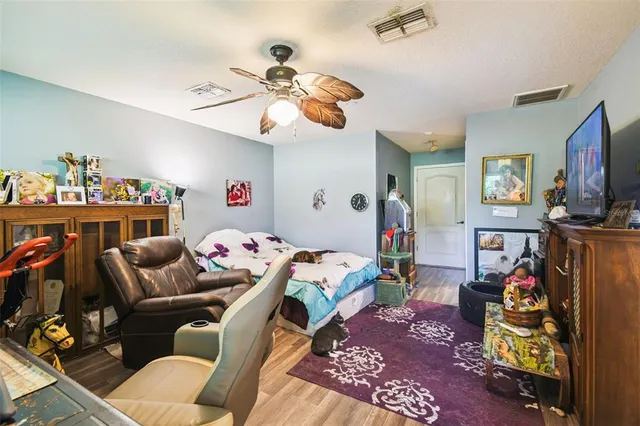 a green field with lots of trees