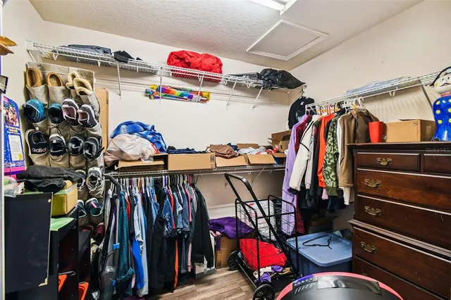 a front view of a house with garden and sitting area