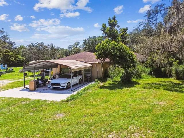 a view of a dining room with furniture and window