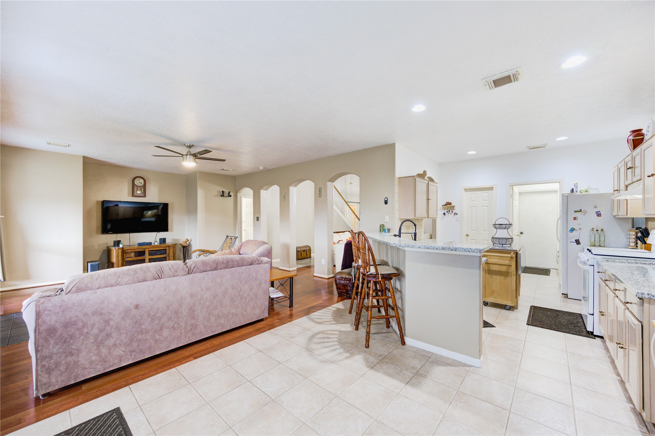 16730 Spring Barker Drive Cypress, TX 77429 - Photo 12 of 50 a living room with furniture and a flat screen tv