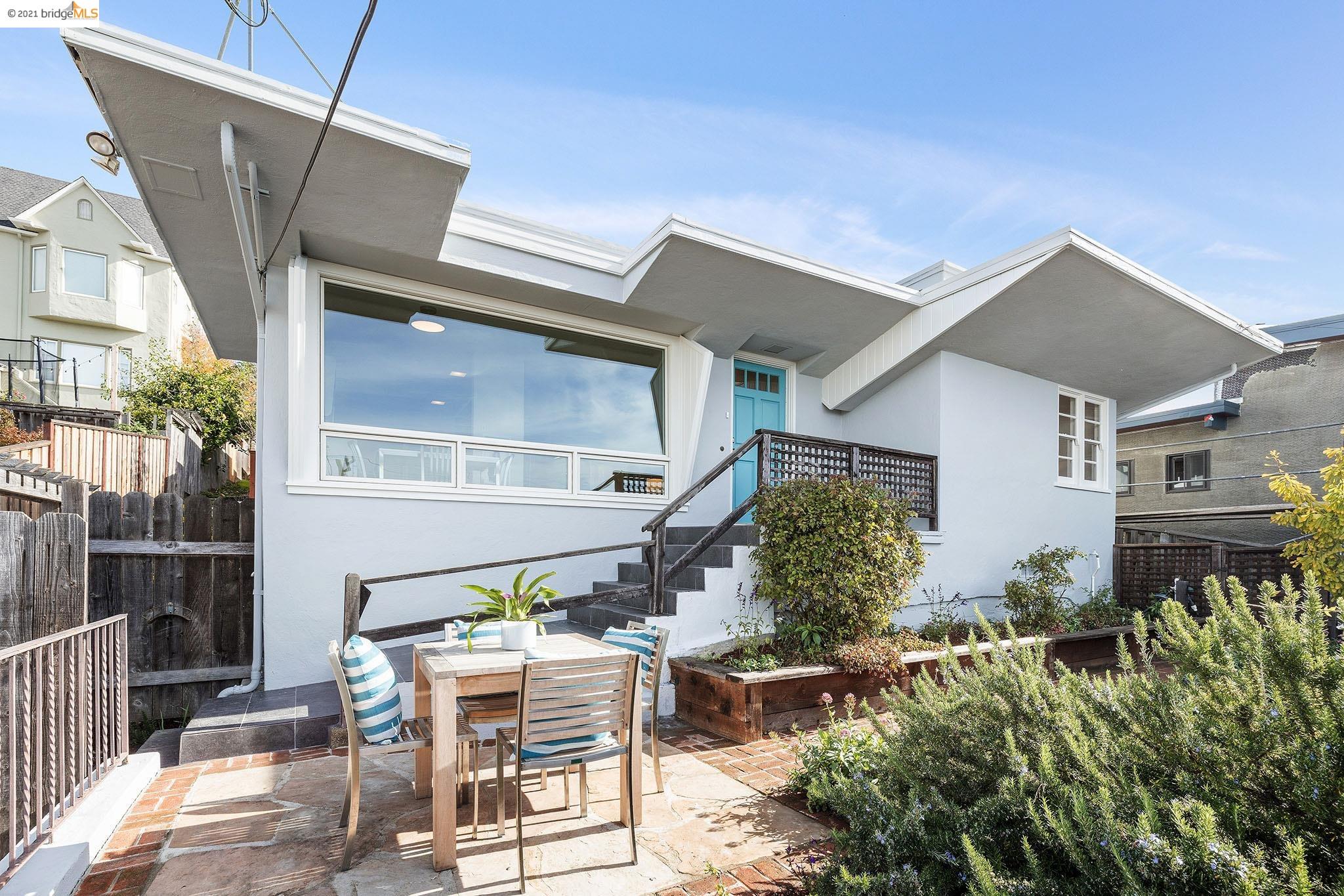 a view of a chairs and table in the patio