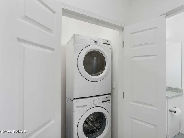 a view of a hallway with washer and dryer