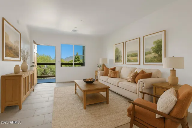 a living room with furniture and a large window