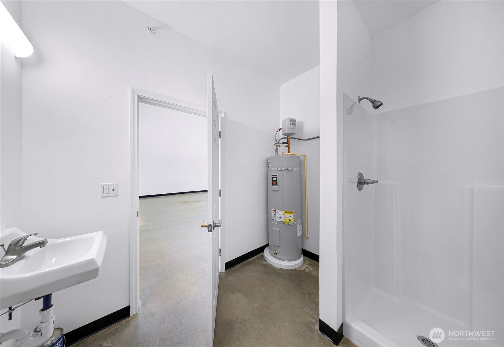 1929 Baltic Way, Unit C110 Ferndale, WA 98248 - Photo 17 of 19 a view of bathroom with a tub shower and sink