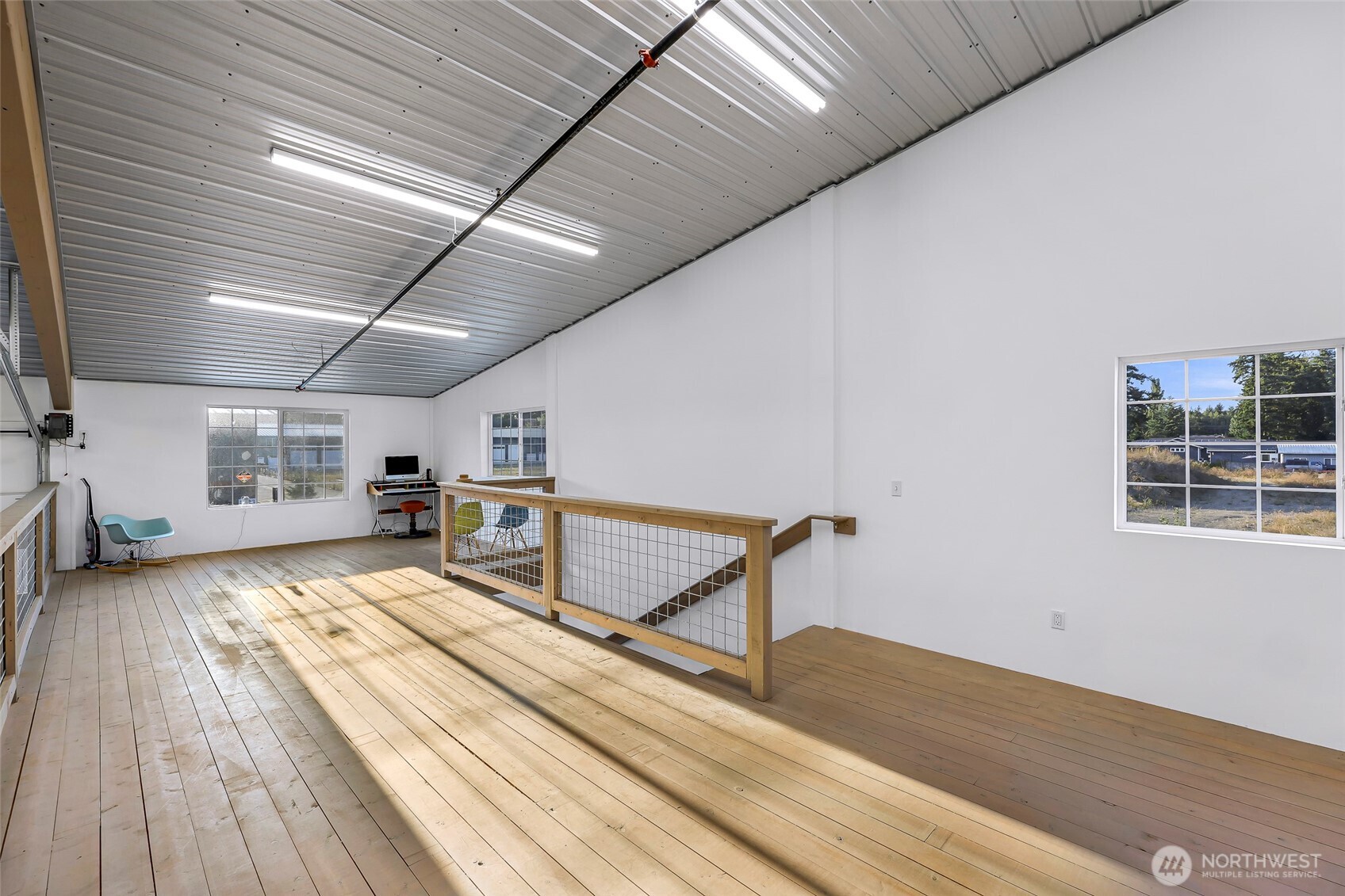 1929 Baltic Way, Unit C110 Ferndale, WA 98248 - Photo 7 of 19 a living room with stainless steel appliances furniture stove and a wooden floor