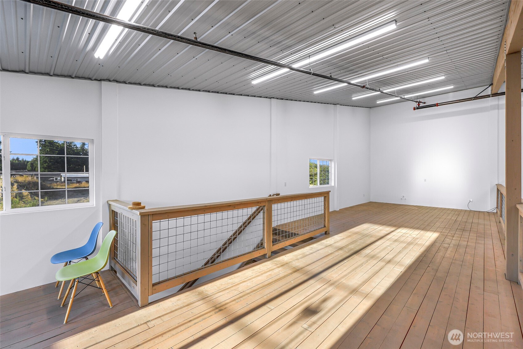 1929 Baltic Way, Unit C110 Ferndale, WA 98248 - Photo 8 of 19 a view of a room with wooden floor and chair