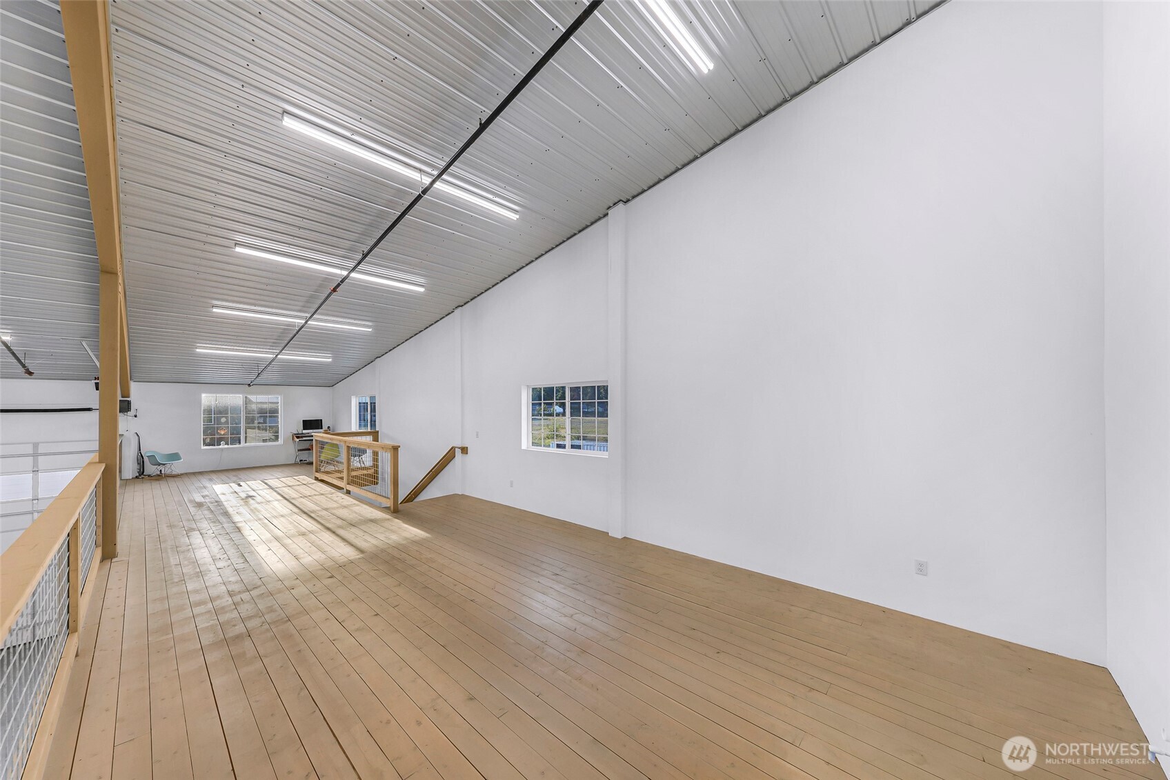 1929 Baltic Way, Unit C110 Ferndale, WA 98248 - Photo 9 of 19 a view of a room with wooden floor